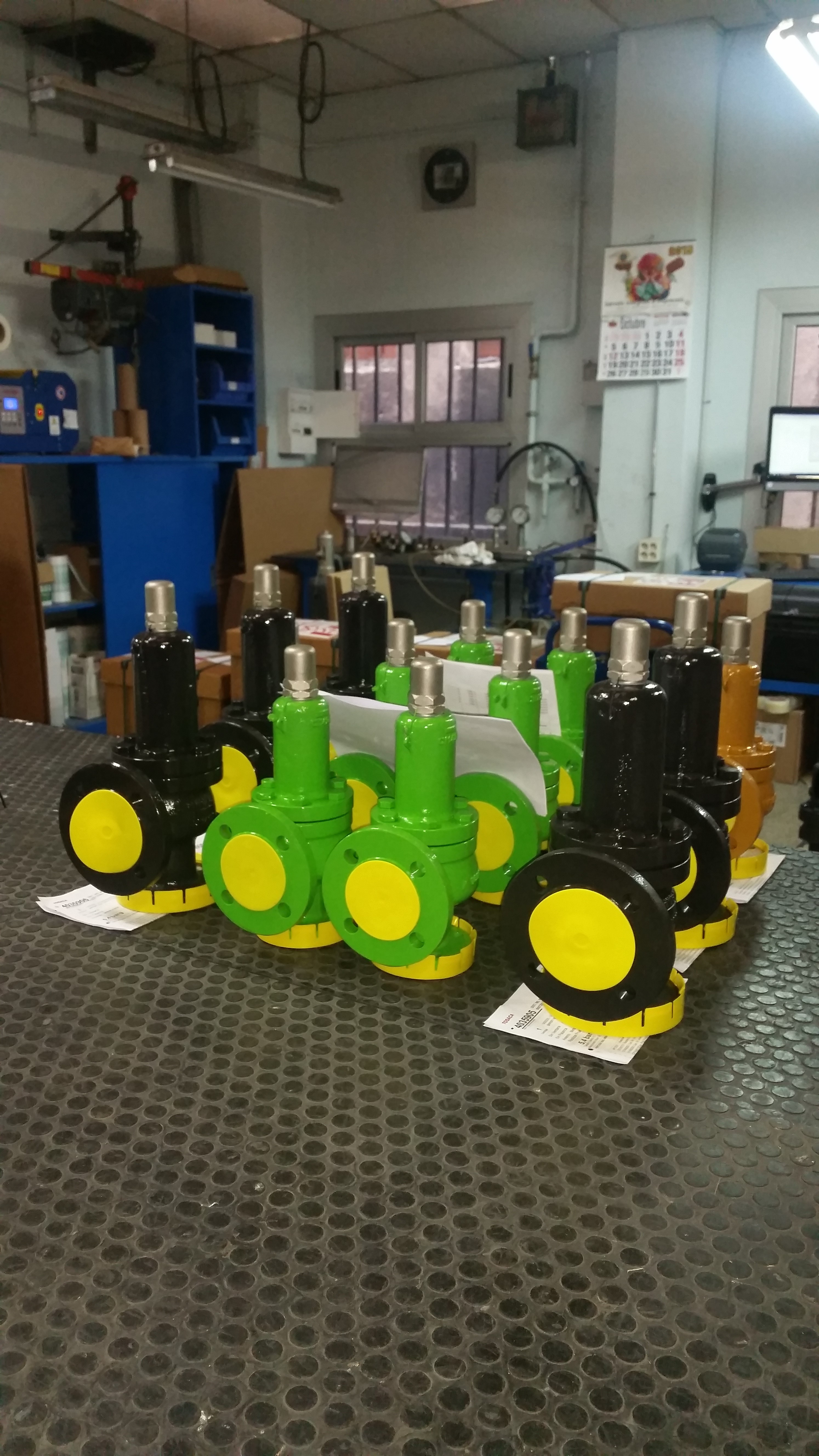 Painted safety valves with protected flange faces during workshop inspection